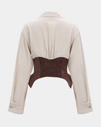 Beige jacket with a brown leather patch on a white background