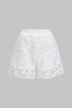 White semi-sheer lace shorts with cut-out detailing